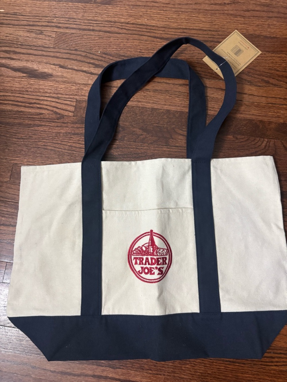 Trader Joe's Beige Canvas Tote with Black Trim and Red Logo